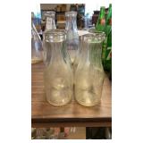 4 clear glass milk bottles