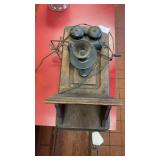 Antique wooden wall-mounted crank telephone