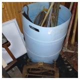 Drum with misc tools, briken reel mower etc