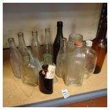 Shelf lot of antique bottles
