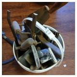 Bucket of masonry tools, trowels, edgers, chisels