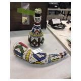 African beaded bottle and horn