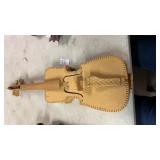 A hand-carved wooden violin-shaped folk art or