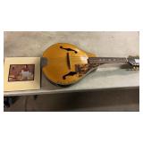 A-style acoustic mandolin, which appears to be a