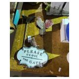 Metal gate sign & chicken & bird