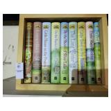Assortment of Laura Ingles books in case