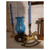Brass rocking horse and candles