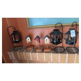 Miniature decorative birdhouses and candle
