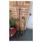 Lot of vintage fishing rods and poles