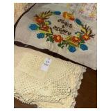 Vintage doilies and embroidered pillowcase