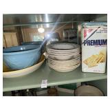 Shelf lot of ceramic bowls and saltine cracker