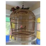 Vintage rattan bird cage with bird and mercury