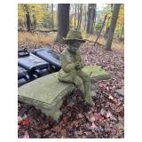 Concrete garden bench and boy sitting