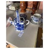 Decorative blue and white watering can,