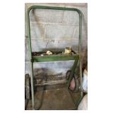 Green metal cart used for welding tanks