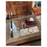 Mirrored vanity tray with watches and stained