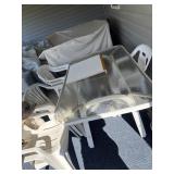 Glass rectangular patio table with 6 plastic
