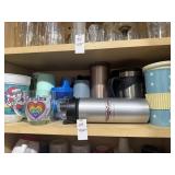 Shelf lot of coffee mugs and assorted tumblers