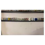 Shelf of Assorted Shot Glasses