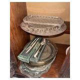 Lot of plastic serving platters and silver
