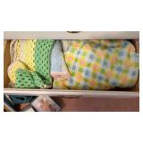 2 drawers with blankets and electronics