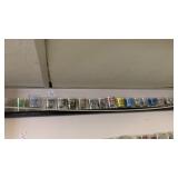 Shelf of Assorted Shot Glasses