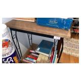 Wrought iron padded top stand with shelf.