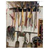 ASSORTED HAND TOOLS AND AIR HOSE ON WALL