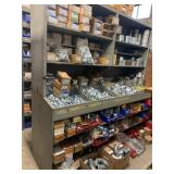 SHELVING UNIT WITH ASSORTED EMT CONDUIT CONNECTORS