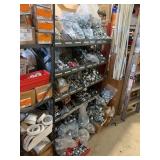 SHELVING UNIT WITH ASSORTED CONDUIT CLAMPS