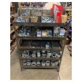 SHELVING UNIT WITH ASSORTED EMT CONDUIT CONNECTORS