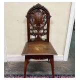 Early 20th Century Intricately Carved Wooden Chair