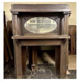 Oak Fireplace Mantel featuring a Beveled Oval Mirr