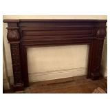 Mahogany Fireplace Mantel Featuring Intricate Carv