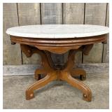 Antique Victorian-Style Table featuring an Oval Wh