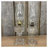 Antique Clear Glass Oil Lamps, one featuring a Squ