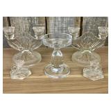 These vintage clear glass candle holders feature a