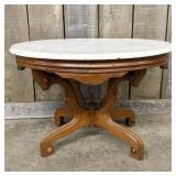Antique Victorian-Style Table featuring an Oval Wh