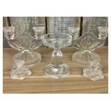 These vintage clear glass candle holders feature a
