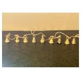 A Set of Nine Graduated Brass Hanging Bells