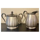 A Pair of Flagg and Homan Pewter Creamer and Lidde