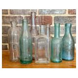 An Assortment of Antique Glass Advertising and Med