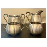 A Collection of Flagg and Homan Pewter Creamers an