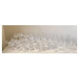 Assortment of approximately 80 pieces of clear gla