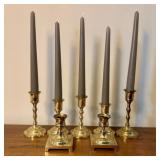 A Set of Seven Assorted Brass Candlesticks