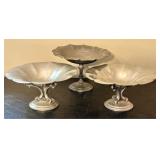 A Trio of Flagg and Homan Pewter Footed Compotes