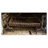 A Pair of Wrought Iron Andirons, a Cast Iron Grate