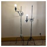 A Pair of Wrought Iron Adjustable Floor Lamps in t
