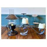 A Trio of Wrought Iron and Metal Candle Holders in