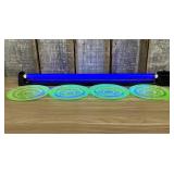A Set of Four Uranium Glass Saucers with Concentri